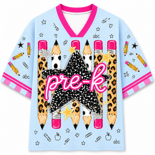 A light blue short-sleeve V-neck t-shirt with a pre-k school theme. The shirt features a large graphic in the center of six pencils with leopard print and white, a black glittery star, a pink script 'pre-k' across the middle, and pink and white striped sleeve cuffs.