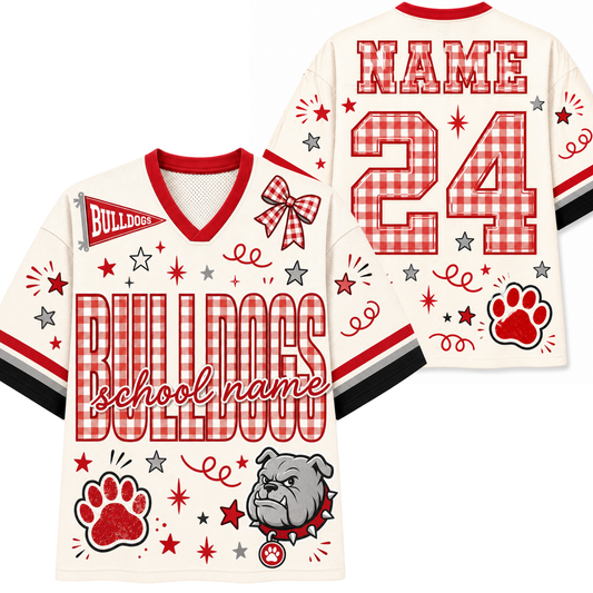 Personalized cream-colored football jersey shown from both front and back, featuring red and white gingham patterned lettering for 'BULLDOGS' and number '24', red paw print, bulldog mascot graphic, and customizable text fields.