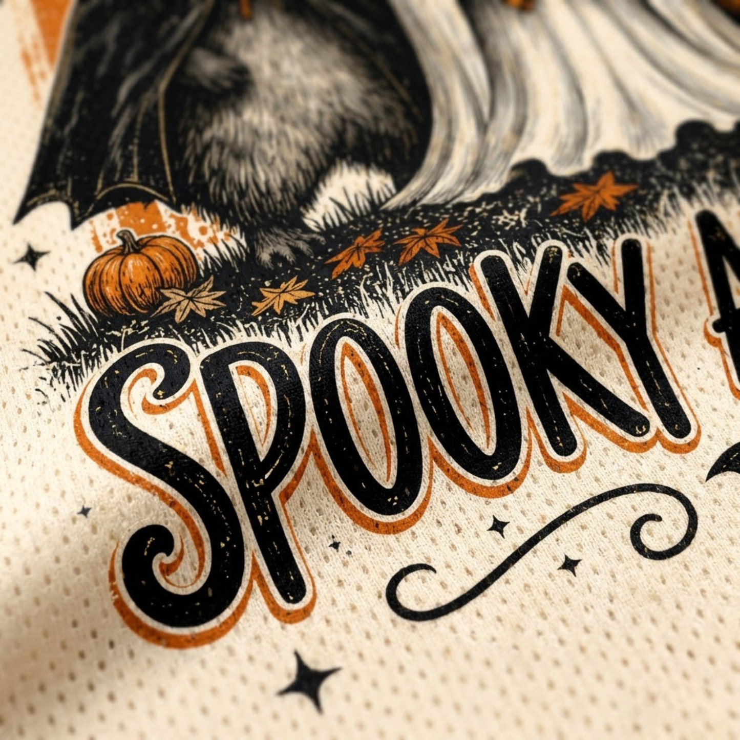 Macro close-up shot of the graphic print on mesh fabric, focusing on the high-definition vintage textures of the witch raccoon fur, plaid bow sheet ghost, and orange polka dot stripes.