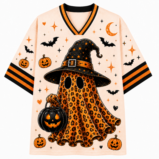 A short-sleeve V-neck jersey-style top with a Halloween ghost graphic. The shirt has an off-white mesh base with orange and black striped sleeves and collar trim, decorated with pumpkins, bats, stars, and a large ghost graphic in a leopard print pattern wearing a witch hat and holding a jack-o'-lantern bucket.