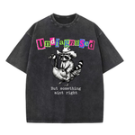 ChaoticClub Undiagnosed Raccoon Washed T-Shirt, vintage oversized graphic tee featuring a cowboy raccoon riding a goose with funny sarcastic text on premium charcoal washed cotton fabric