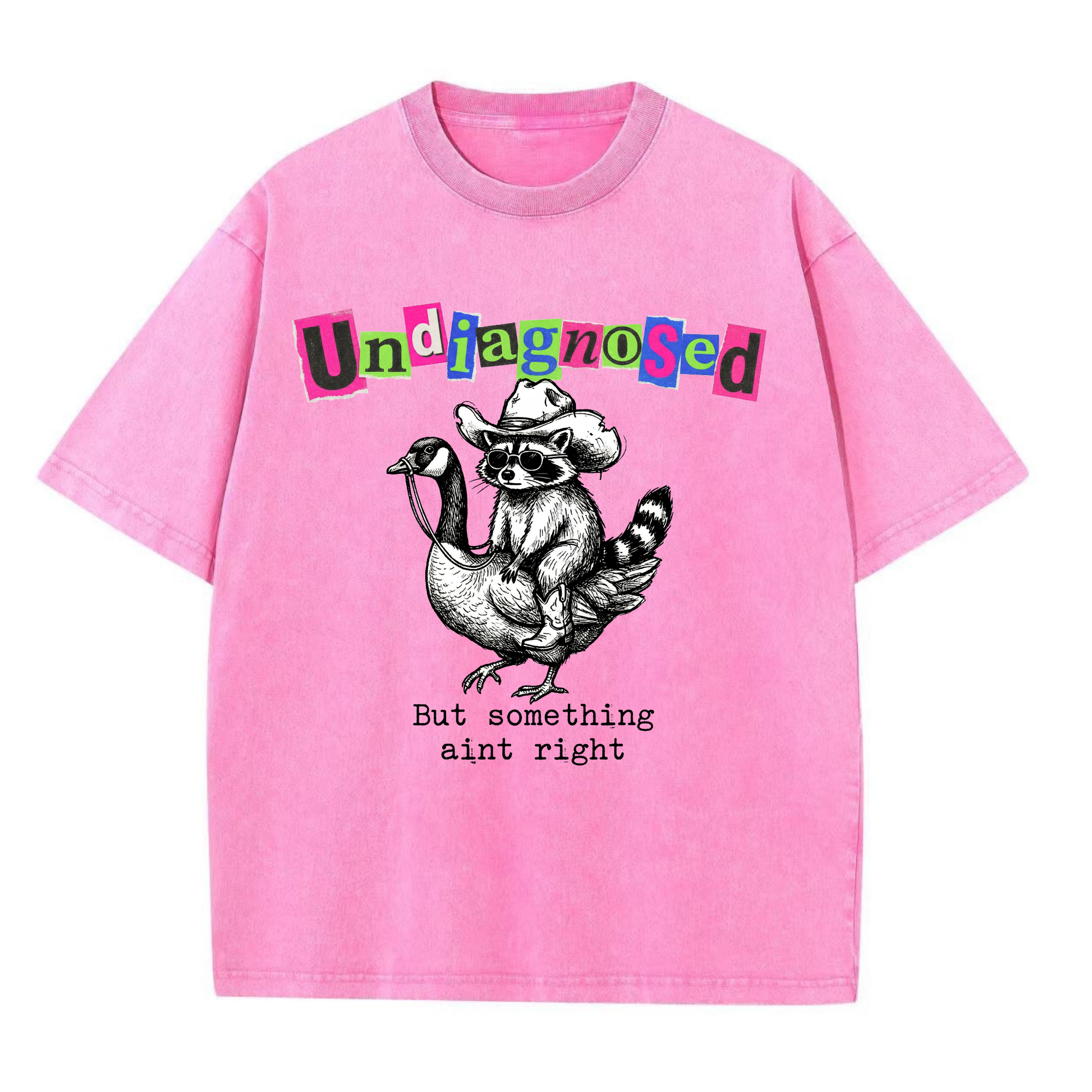 ChaoticClub Undiagnosed Raccoon Washed T-Shirt, vintage oversized graphic tee featuring a cowboy raccoon riding a goose with funny sarcastic text on premium charcoal washed cotton fabric