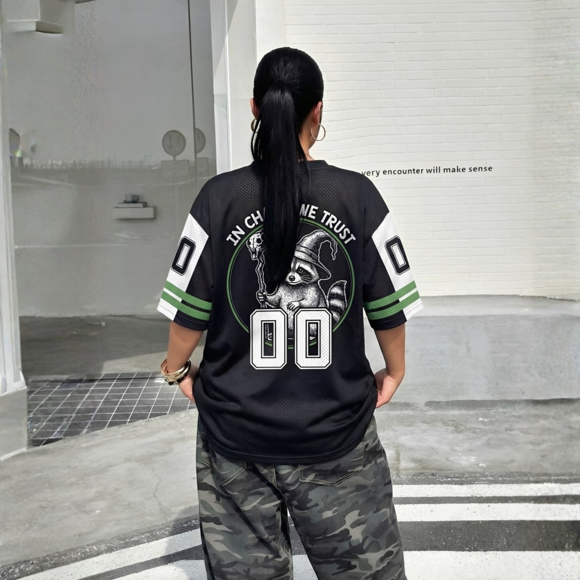 ChaoticClub Off To Commit Tomfoolery Raccoon Mesh Jersey, vintage streetwear athletic jersey featuring a wizard raccoon and "In Chaos We Trust" graphic on breathable black and green mesh fabric