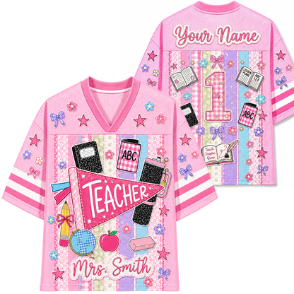 Front and back view of the pink ChaoticClub Preppy Back To School Teacher Pennant Flag Mesh Jersey, featuring a teacher pennant, globe, notebooks, and customizable name text.