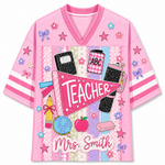 Front view of the pink ChaoticClub Preppy Back To School Teacher Pennant Flag Mesh Jersey, featuring a pink teacher pennant, globe, notebooks, apple, and custom "Mrs. Smith" text.