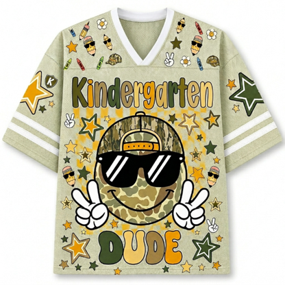 Front view of the khaki ChaoticClub Retro Back to School Smiley Face Mesh Jersey, featuring a cool camo smiley with sunglasses, peace signs, and Kindergarten Dude text.