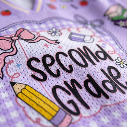 ChaoticClub mesh jersey close up showing breathable Bird’s Eye Pique fabric with pastel purple gingham stripes and high-quality print of school graphics