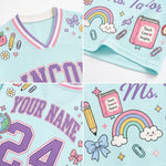 A light blue personalized sports jersey shown in a four-panel collage, featuring purple varsity-style lettering, a pink book graphic that reads 'Teach Love Inspire,' a rainbow, bows, stars, paperclips, and the text 'YOUR NAME' and '24.'.