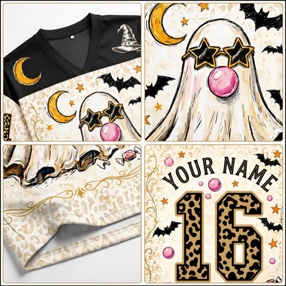 Halloween-themed shirt with ghost, moon, and bat designs on a white background.