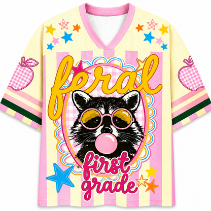 ChaoticClub Feral Raccoon Bubblegum Striped Mesh Jersey in pastel yellow and pink, featuring a sassy raccoon blowing a bubble with pink sunglasses, surrounded by stars and "feral first grade" text.