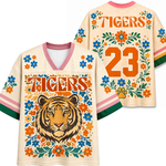 Front and back views of the ivory ChaoticClub Floral School Spirit Personalized Mesh Jersey, displaying the detailed wildcat mascot front graphics and the customizable team number "23" back design framed by pink and orange flowers.