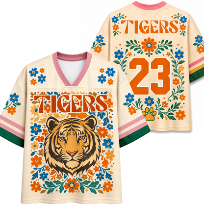 Front and back views of the ivory ChaoticClub Floral School Spirit Personalized Mesh Jersey, displaying the detailed wildcat mascot front graphics and the customizable team number "23" back design framed by pink and orange flowers.