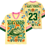 Front and back views of the yello pastel ChaoticClub Floral School Spirit Personalized Mesh Jersey, displaying the detailed wildcat mascot front graphics and the customizable team number "24" back design framed by pink and orange flowers.