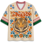 Front view of the white ChaoticClub Floral School Spirit Personalized Mesh Jersey, featuring a large Ivory Tigers mascot head surrounded by a symmetrical folk-art floral border in orange and blue, with row of stars below the v-neck collar