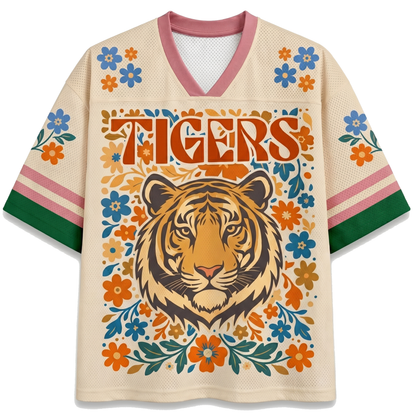 Front view of the white ChaoticClub Floral School Spirit Personalized Mesh Jersey, featuring a large Ivory Tigers mascot head surrounded by a symmetrical folk-art floral border in orange and blue, with row of stars below the v-neck collar