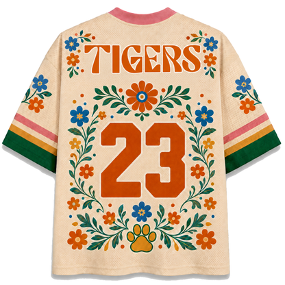 Back view of the ChaoticClub Floral School Spirit Personalized Mesh Jersey, showcasing bold "TIGERS" text above a large oraneg varsity number "23" outlined in white, framed by matching floral vines and a prominent paw print icon at the bottom.