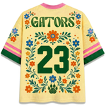 Back view of the ChaoticClub Floral School Spirit Personalized Mesh Jersey, showcasing bold "GATORS" text above a large green varsity number "23", framed by matching floral vines and a prominent paw print icon at the bottom.