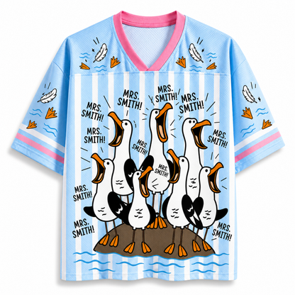 Children's shirt with cartoon geese and text on a blue and white striped background