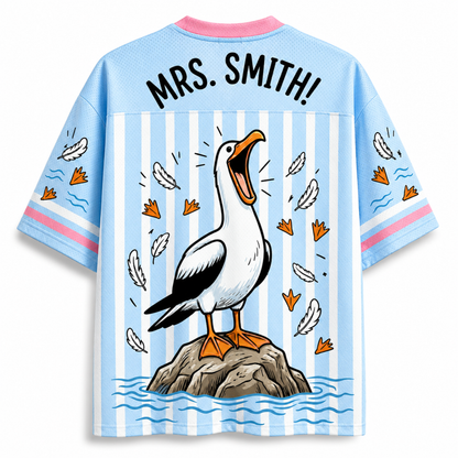 Shirt with a cartoon pelican design and 'Mrs. Smith!' text on a blue and white striped background
