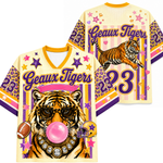 Colorful sports jerseys with tiger graphics and 'Geaux Tigers' text on a white background