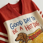 ChaoticClub Good Day To Be A Hot Dog Mesh Jersey, vintage athletic oversized jersey on cream and red breathable mesh featuring a whimsical dachshund in a bun graphic with playful "Good Day To Be A Hot Dog" text.