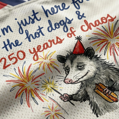 ChaoticClub Here For Hot Dogs & Chaos Possum Mesh Jersey, vintage athletic oversized jersey on patriotic cream, red, and blue breathable mesh featuring an opossum with a hot dog and sparkler amidst fireworks with "250 years of chaos" text.