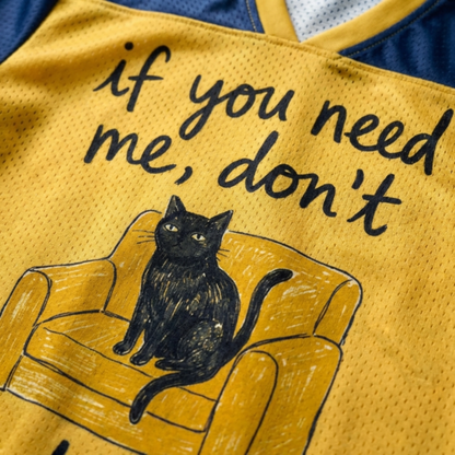 ChaoticClub If You Need Me Don’t Cat Meme Mesh Jersey, vintage athletic oversized jersey on yellow and navy blue breathable mesh featuring a black cat sitting on a chair with "if you need me, don't" funny sarcastic text.