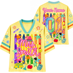 Colorful shirt with educational graphics and 'Your Name' text on a white background