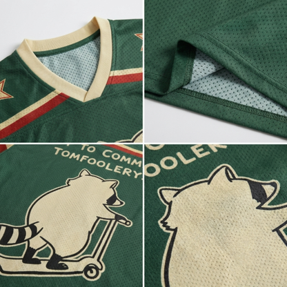 ChaoticClub Off To Commit Tomfoolery Mesh Jersey, vintage athletic oversized jersey on forest green and cream breathable mesh featuring a raccoon riding a scooter with "Off to commit tomfoolery" funny sarcastic text.