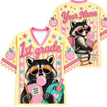 Front and back views of the ChaoticClub Pastel Bubblegum Raccoon Teacher Mesh Jersey. Front displays the raccoon with a backpack and "1st grade" text, while the back shows the raccoon sitting on books with customizable name text.