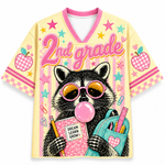 Front view of the ChaoticClub Pastel Bubblegum Raccoon Teacher Mesh Jersey, featuring a cute raccoon in pink sunglasses blowing bubblegum, a blue backpack, and bold "2nd grade" text on a pastel striped background.