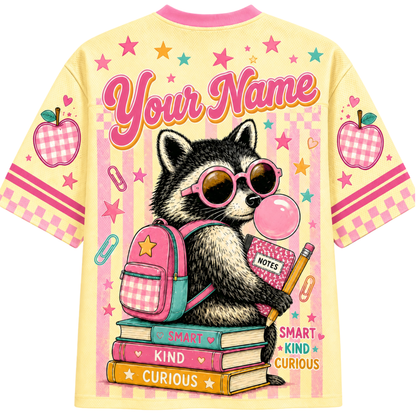 Back view of the ChaoticClub Pastel Bubblegum Raccoon Teacher Mesh Jersey, displaying a customizable "Your Name" text above a raccoon sitting on a stack of books with "Smart Kind Curious" text.
