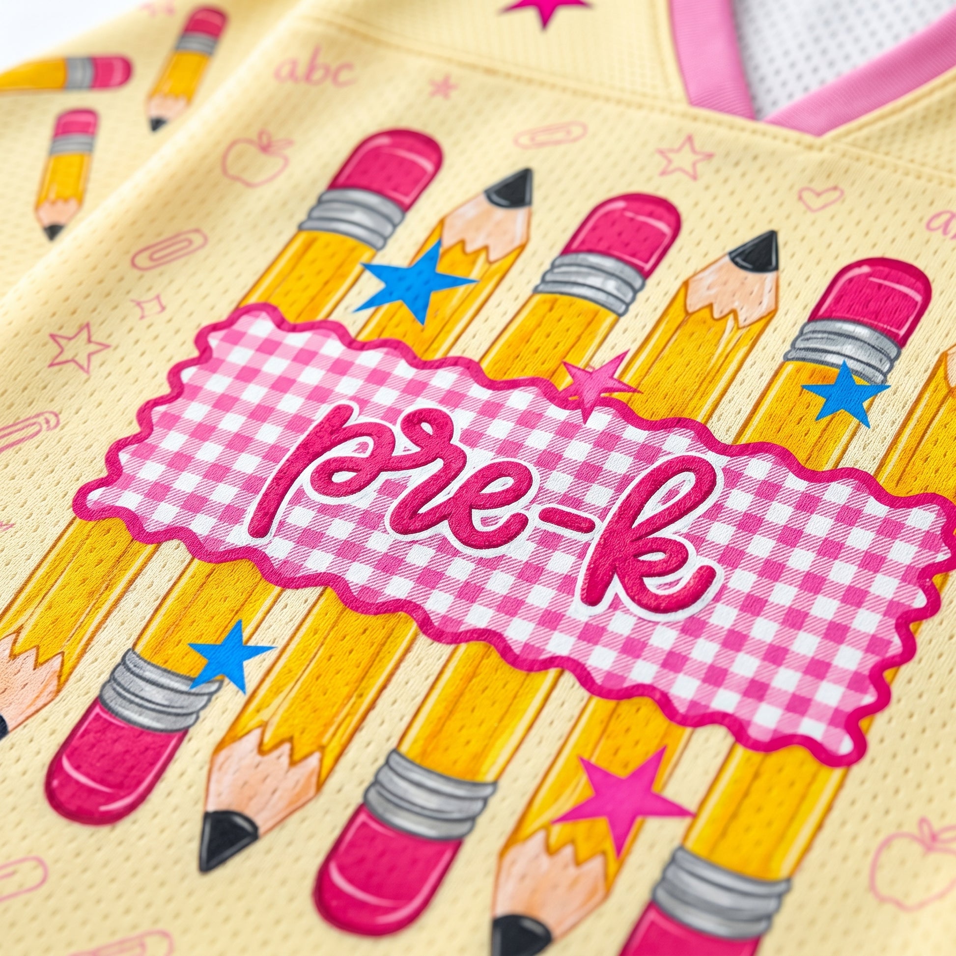 preppy mesh jersey close up showing breathable Bird’s Eye Pique fabric with pencil illustrations and high quality print detail