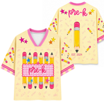 Two yellow t-shirts with pencil designs and 'pre-k' text on a white background