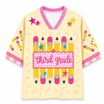 Children's shirt with 'third grade' design featuring pencils and stars on a yellow background.