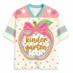 Front view of the ChaoticClub Preppy Back to School Teacher Apple Mesh Jersey, featuring a cute apple graphic with a pink bow, colorful polka dots, and gold glitter "kindergarten" text.