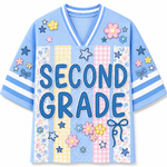 Front view of the light blue ChaoticClub Preppy School Grade Floral Pearl Striped Mesh Jersey, featuring bold dotted "SECOND GRADE" text on a background of pastel yellow gingham, pink gingham, and floral stripes, decorated with cute flower and star graphics.