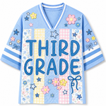 Front view of the light blue ChaoticClub Preppy School Grade Floral Pearl Striped Mesh Jersey, featuring bold dotted "THIRD GRADE" text on a background of pastel yellow gingham, pink gingham, and floral stripes, decorated with cute flower and star graphics.