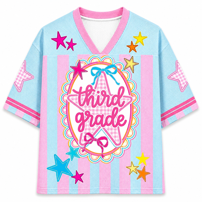 Children's jersey with 'third grade' text and star designs on a light blue background