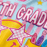 ChaoticClub mesh jersey close up showing breathable Bird’s Eye Pique fabric with pastel checkered stripes, high-quality print of smiley face, and stars
