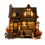 A detailed miniature dollhouse of 'The Anna Bookshop' decorated for autumn, featuring a small bench with a plaid throw and black cat, potted plants, pumpkins, and warm glowing windows against a white background.