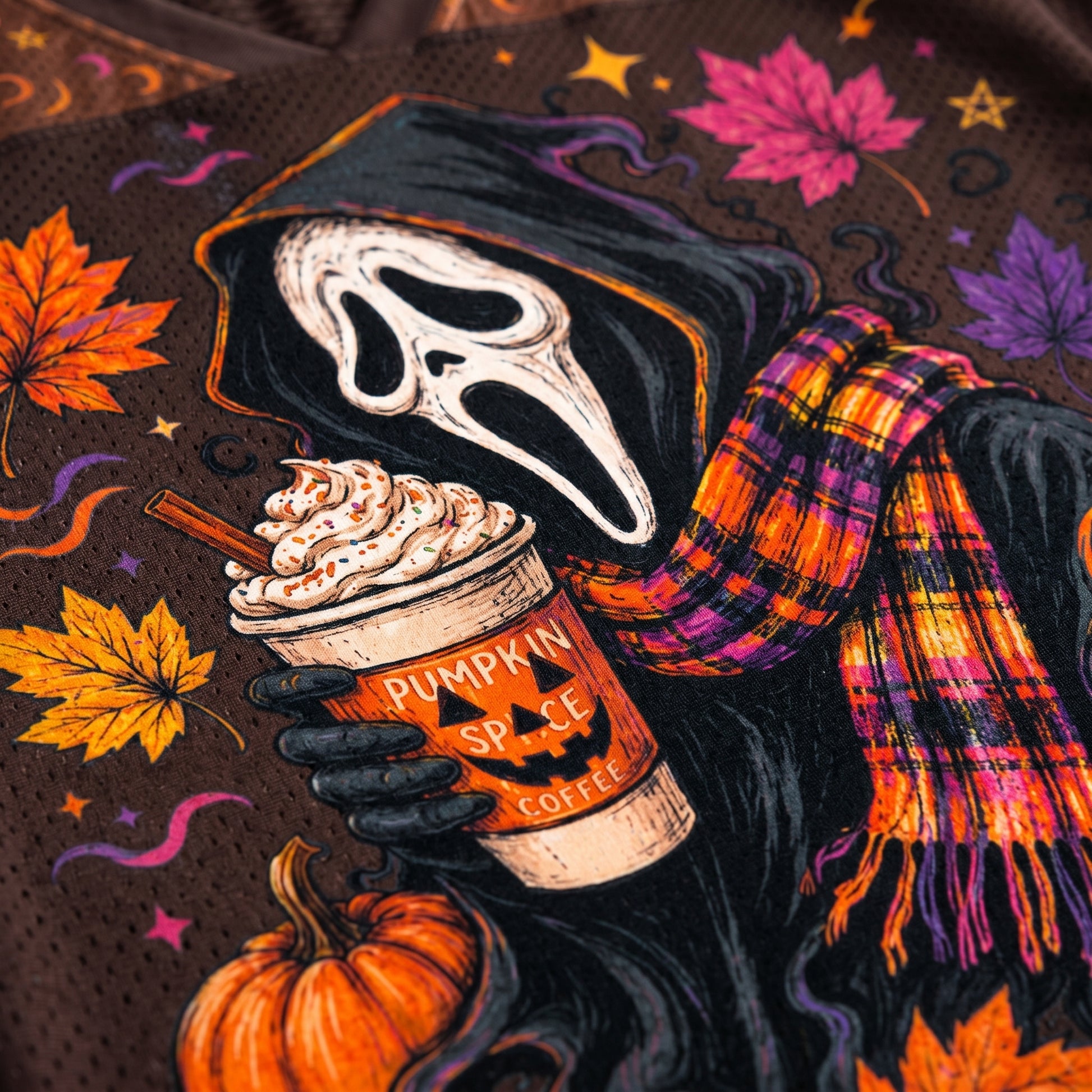 Halloween-themed design with a skeleton holding a pumpkin spice coffee cup, surrounded by autumn leaves and pumpkins.