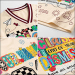 Detailed close up of ChaoticClub summer break jersey print highlighting the textured colorful "CLASS DISMISSED" bubble letters and smiley faces on bird's eye pique mesh.