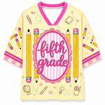 Yellow shirt with 'fifth grade' text and pencil designs on a white background