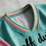 ChaoticClub Off Duty Moms Club Raccoon Mesh Jersey, vintage athletic oversized jersey on teal, pink, and yellow breathable mesh featuring a happy raccoon on a scooter with a tote bag and "off duty moms club go ask your dad" funny sarcastic text.