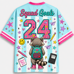 Colorful jersey with a raccoon character, 'Squad Goals 24', and various graphics on a light blue background.