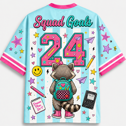 Colorful jersey with a raccoon character, 'Squad Goals 24', and various graphics on a light blue background.