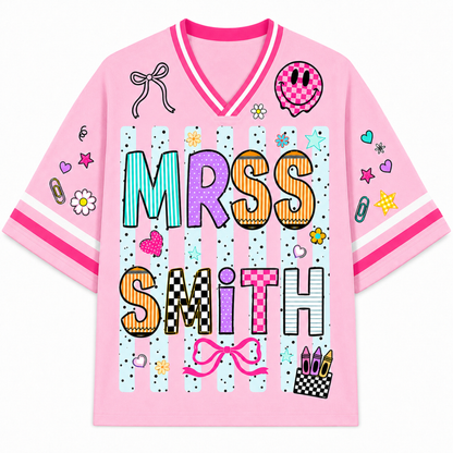 Pink shirt with 'Mrs. Smith' text and various graphics on a white background
