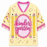 Yellow shirt with pink accents and 'kindergarten' text, featuring pencils and educational symbols on a white background.