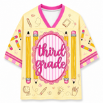 Yellow jersey with 'third grade' text and pencil designs on a white background